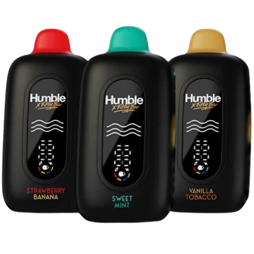 Three black Humble X-Treme Plus vape devices with different colored caps and flavor labels on a black background.