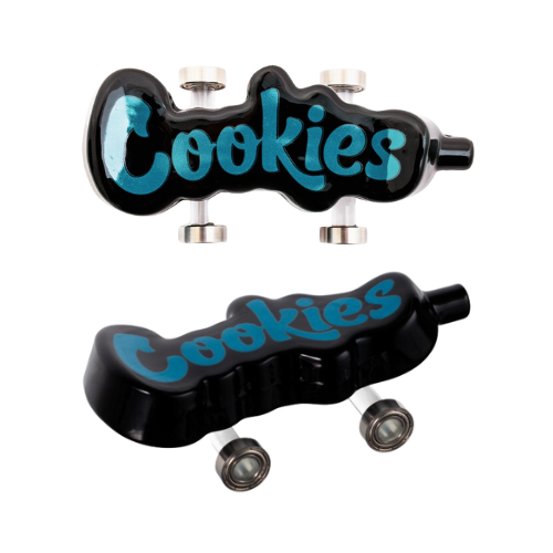 Cookies Toke Deck - Black | Enhance your smoking experience with the Cookies Toke Deck. This unique mini-skateboard also serves as a fashionable pipe, combining creativity and functionality. Featuring metal wheels, it's essential for any collection.